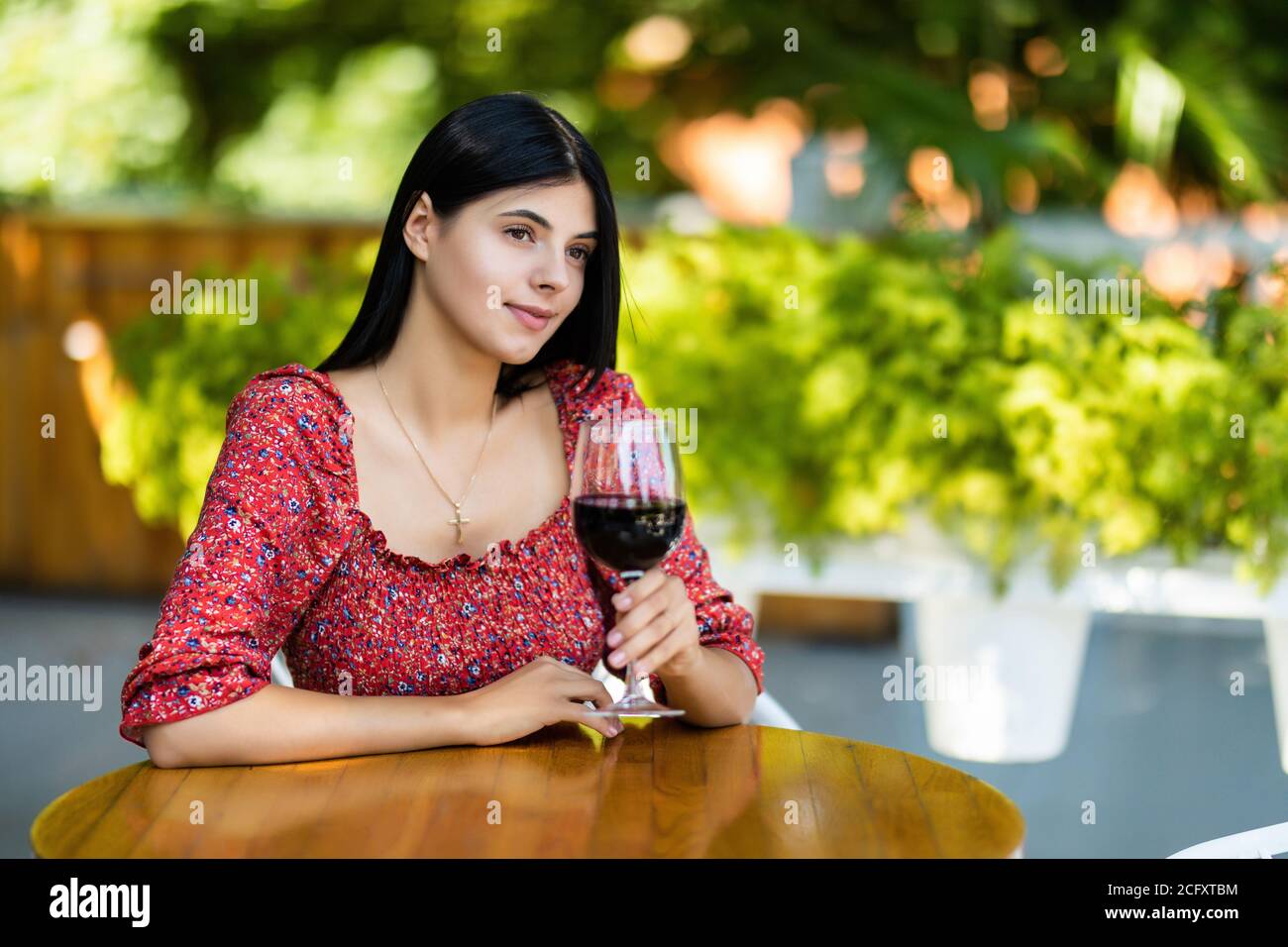 Beautiful woman with glass of luxury red wine Stock Photo - Alamy