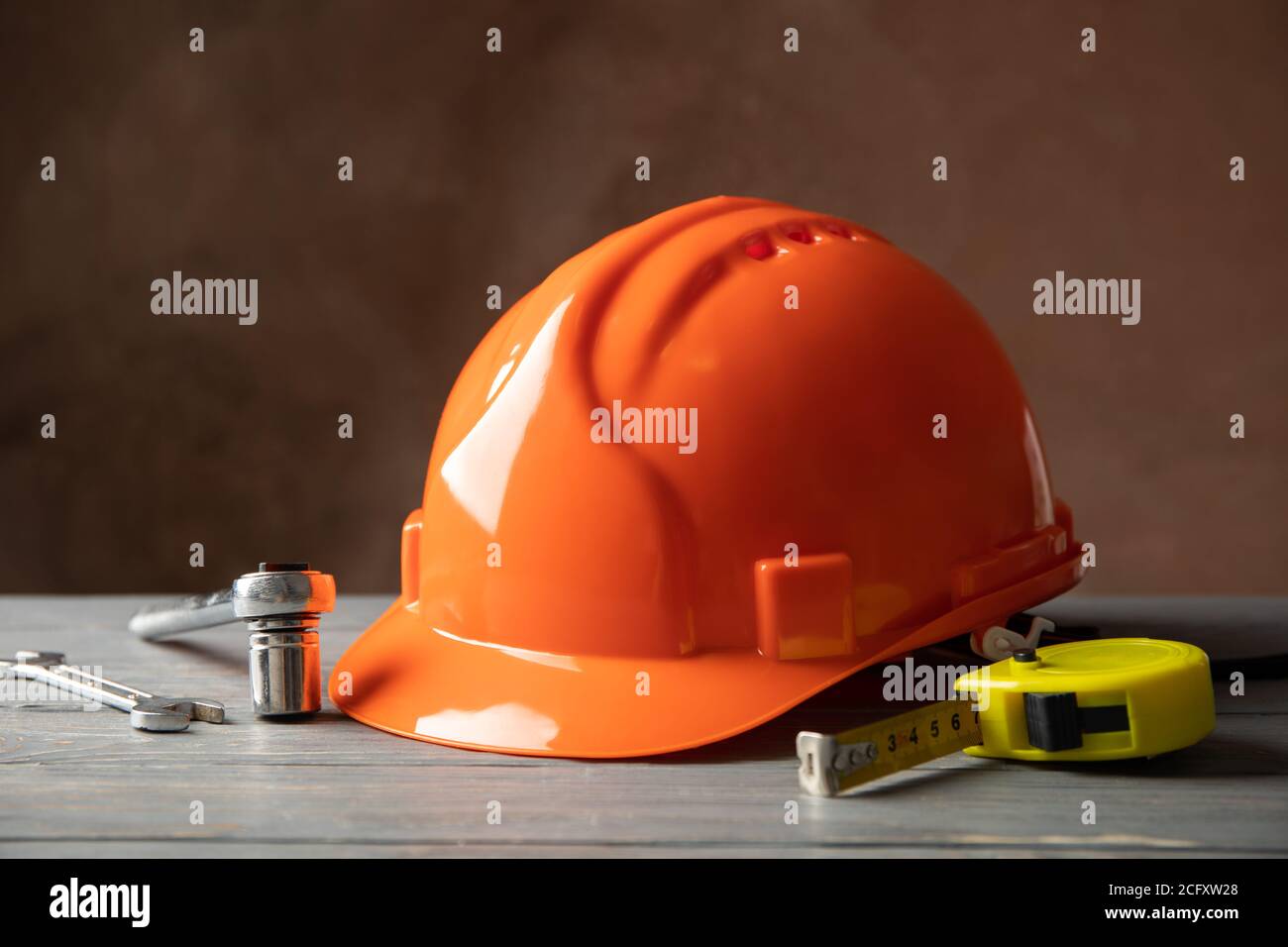 Different construction tools on white wooden table Stock Photo
