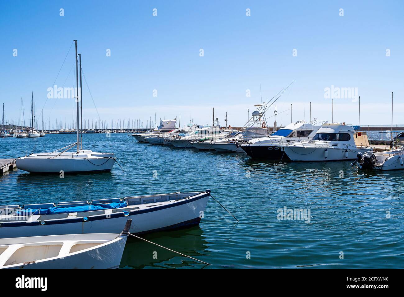 fishing boats moored in a pier mediterranean sea dock Stock Photo - Alamy