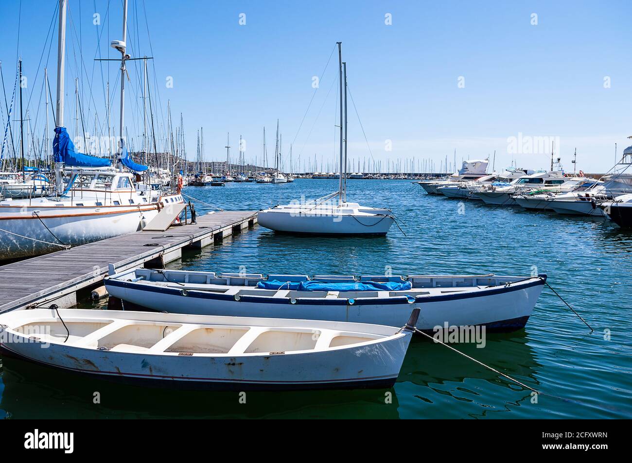 Traditional fishing boats moored in a pier, close Stock Photo - Alamy