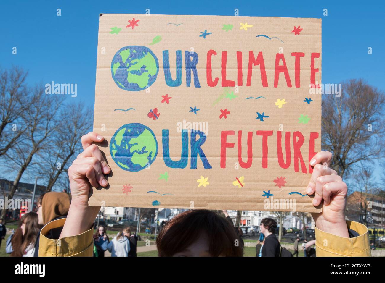 Signs at the school climate strike where youths protested about the ...