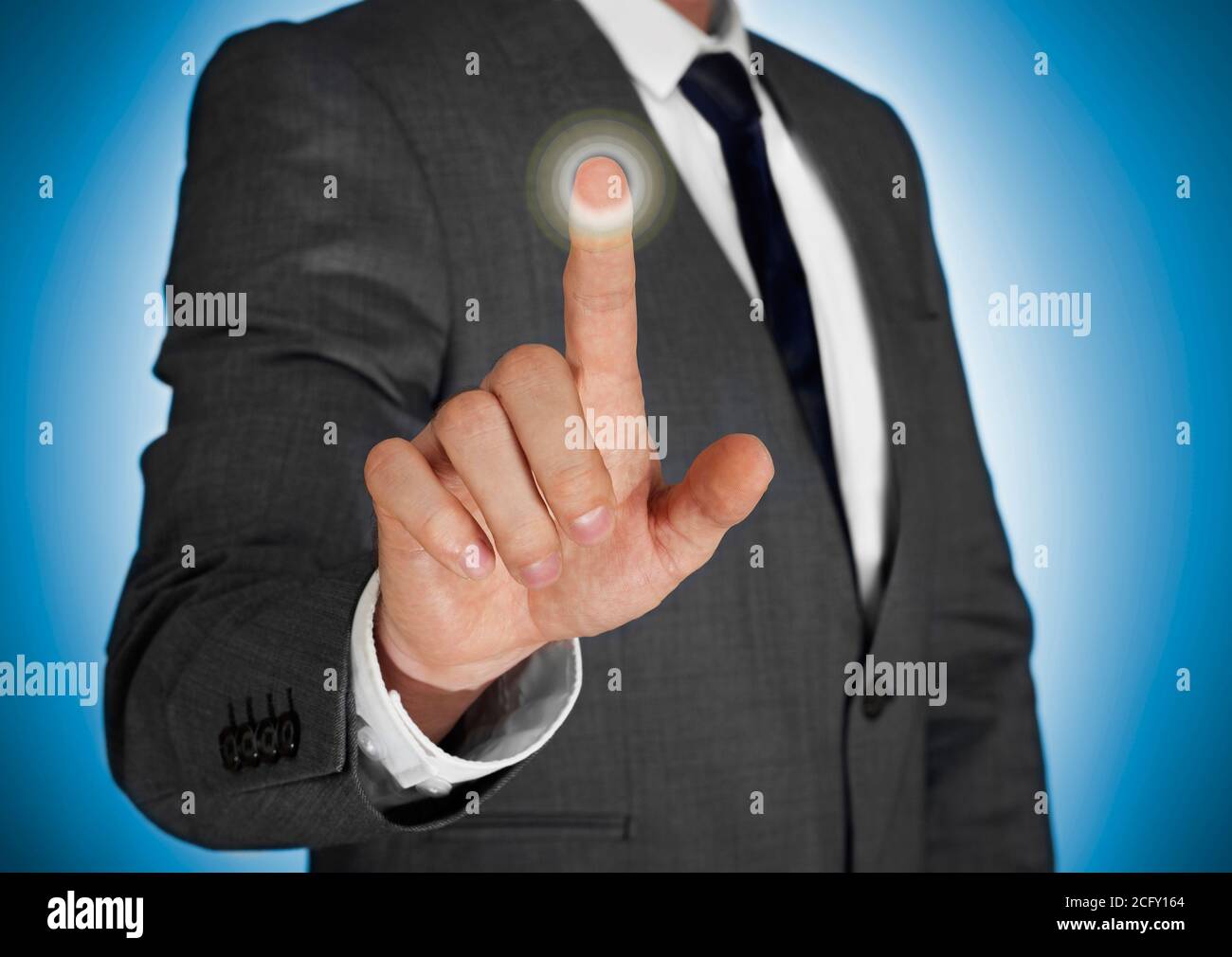 Businessman touching a virtual screen Stock Photo