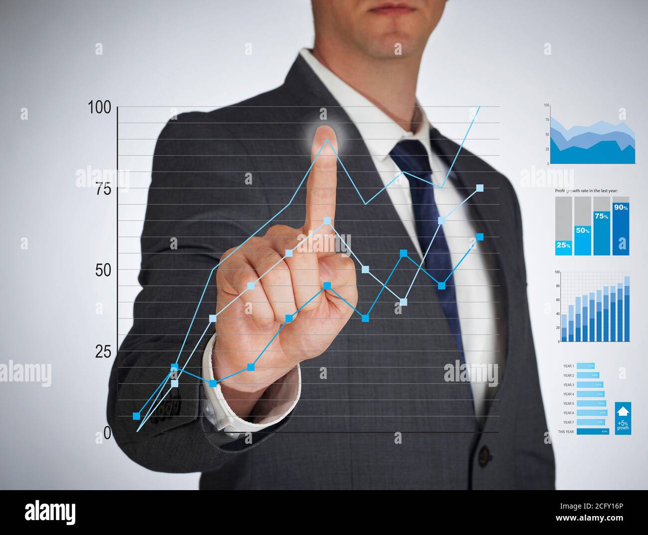 Businessman touching a virtual screen Stock Photo