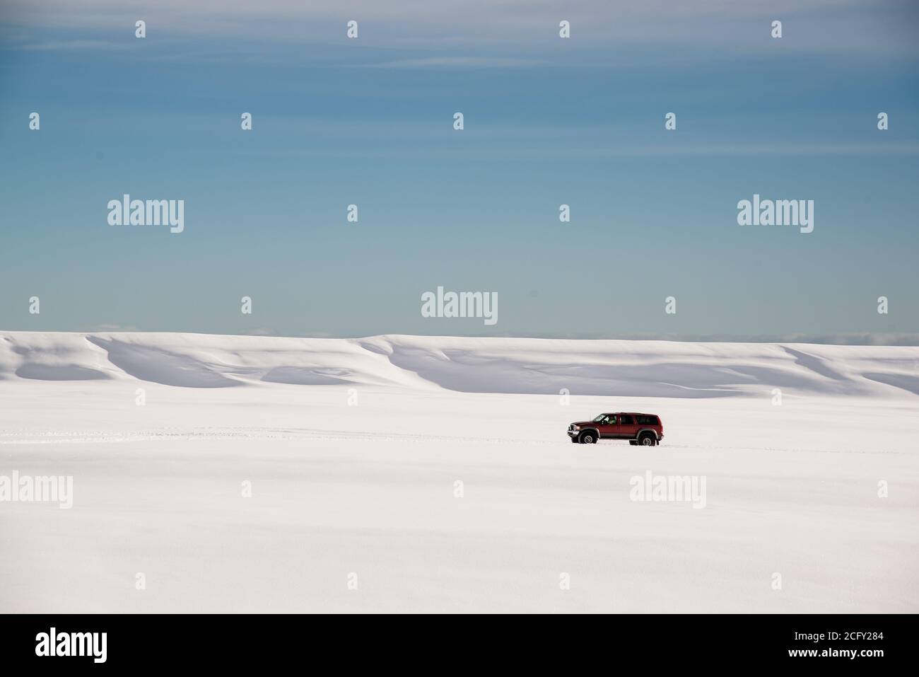 Huge Jeep travel across deep snow fields Stock Photo