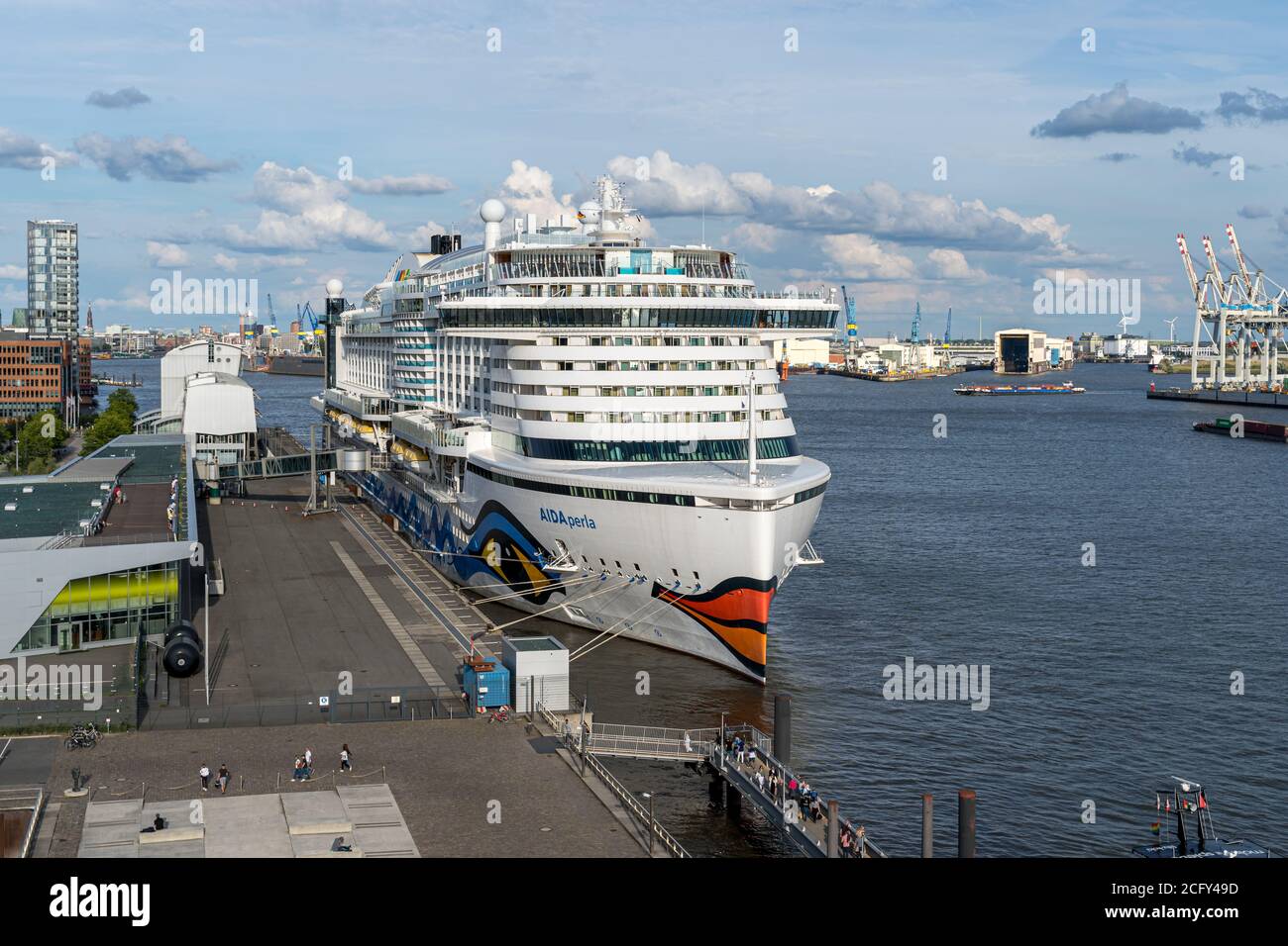 Cruise ship AIDA perla in the harbor of Hamburg with a fantastic sky with  beautiful clouds at the Altona Cruise Center near the office building  Dockla Stock Photo - Alamy