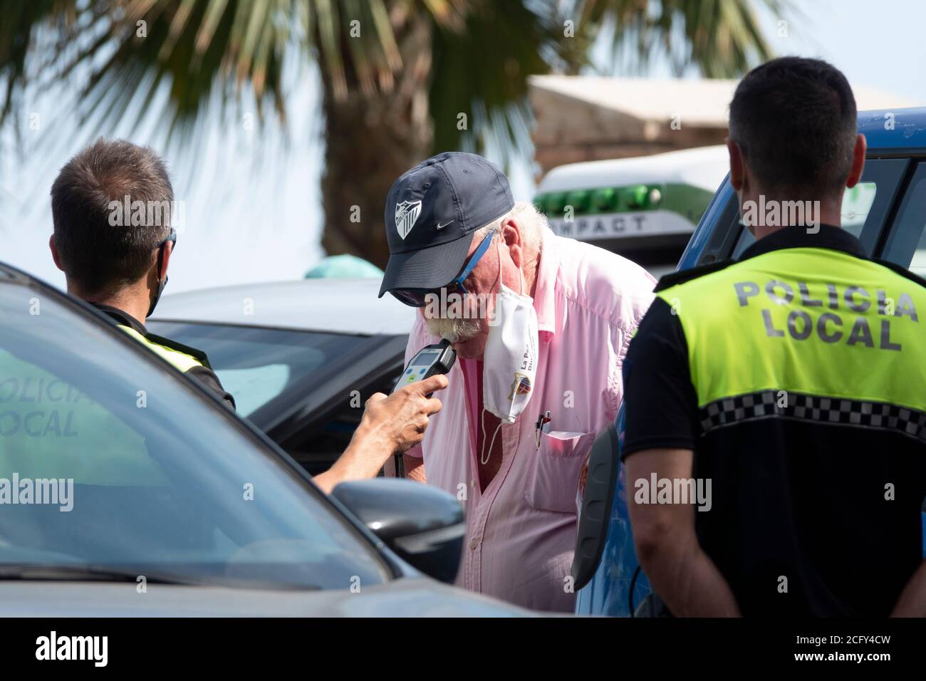 pic shows:  Fuengirola 2020 man breathalyzer test but he passed the test and was allowed to go on Stock Photo