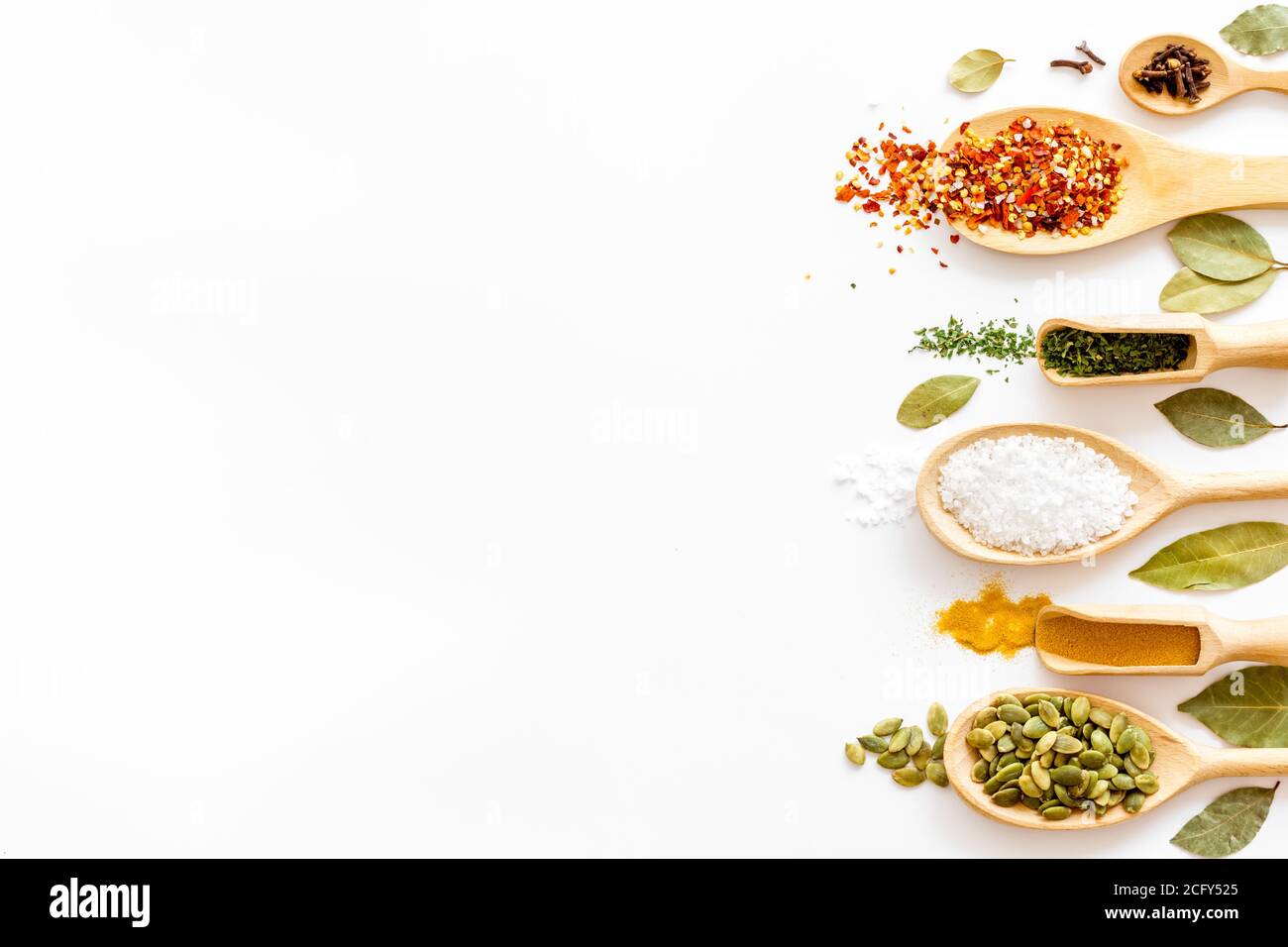 Layout of various spices in spoons. Top view, copy space Stock Photo ...