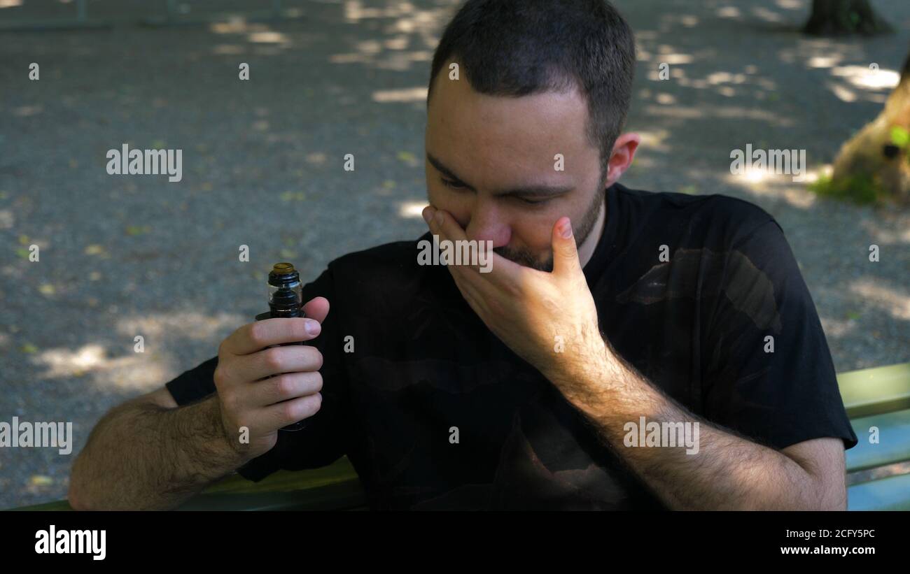Smoker Man coughing after vape Stock Photo Alamy