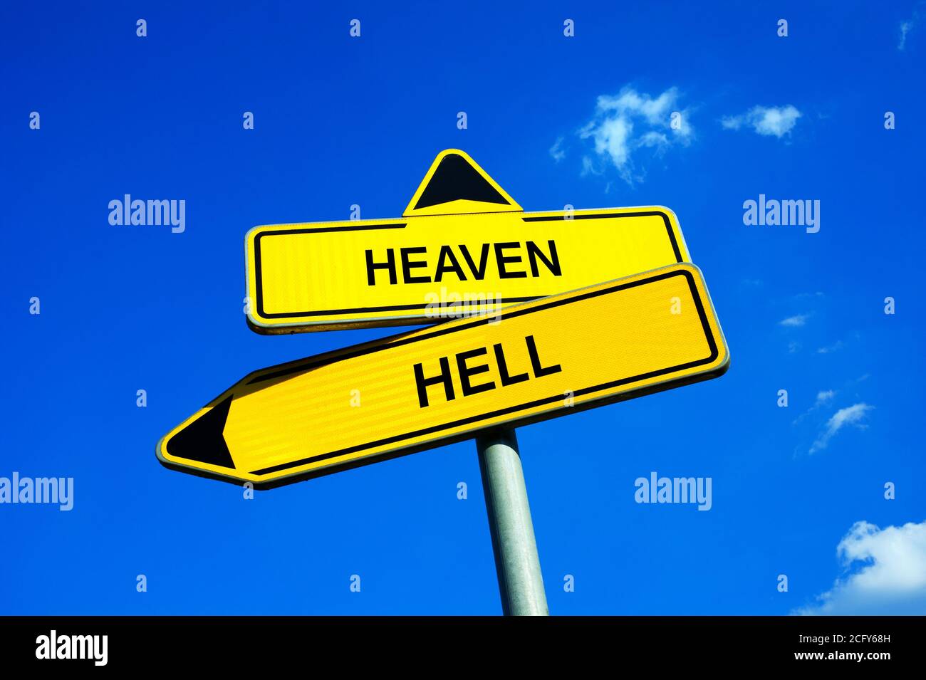 Heaven or Hell - Traffic sign with two options. Religious afterlife reward / punishment based on good, evil, sins. Eternal salvation of damnation. Stock Photo