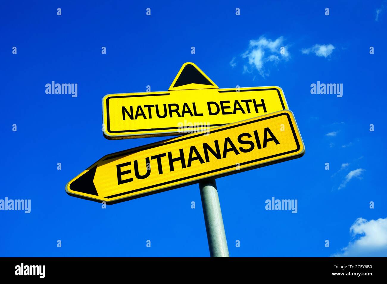 Natural Death or Euthanasia - Traffic sign with two options - deciding between assisted death and suffering because of incurable disease or illness. Q Stock Photo