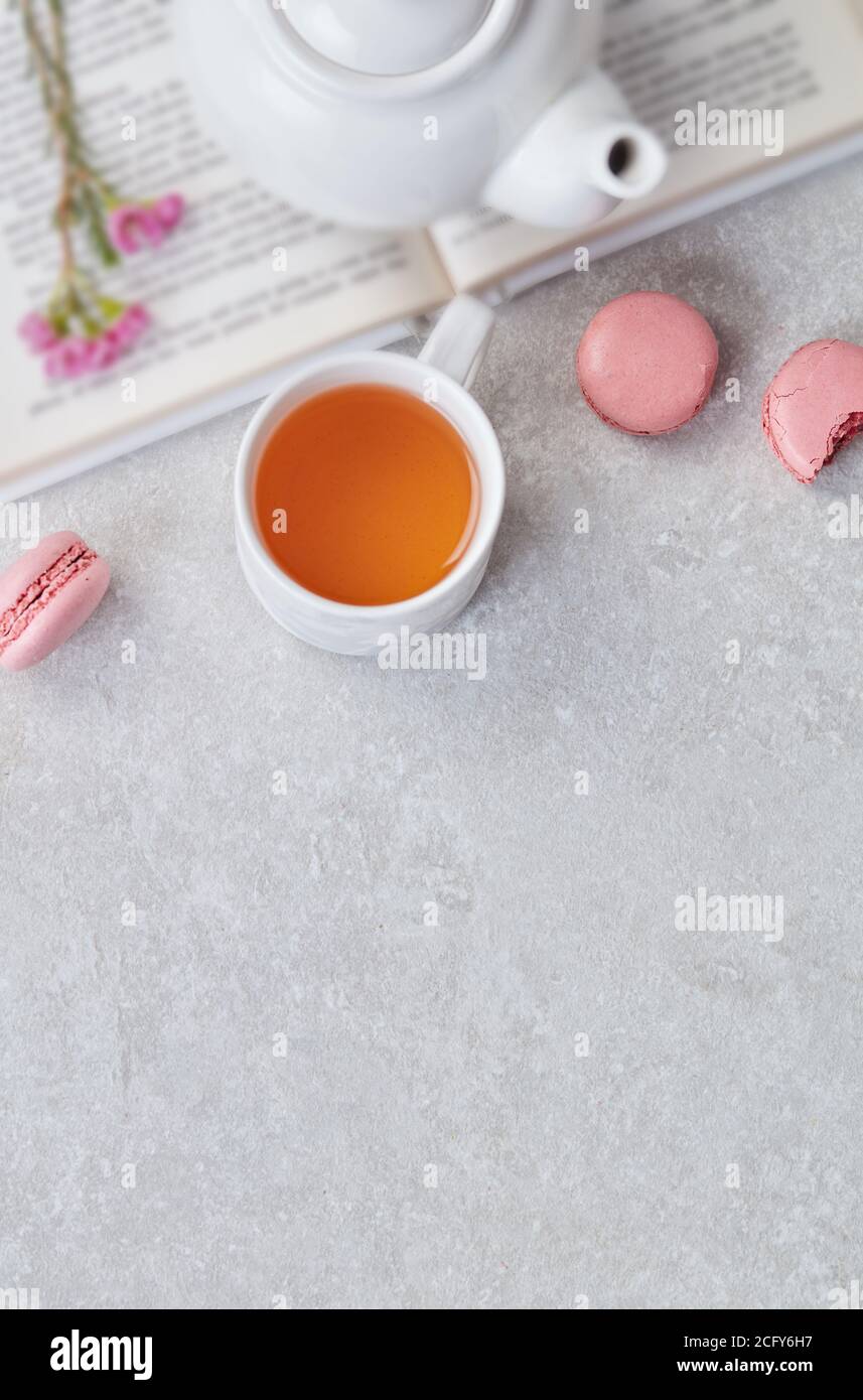 Tea and macaroons on table Stock Photo