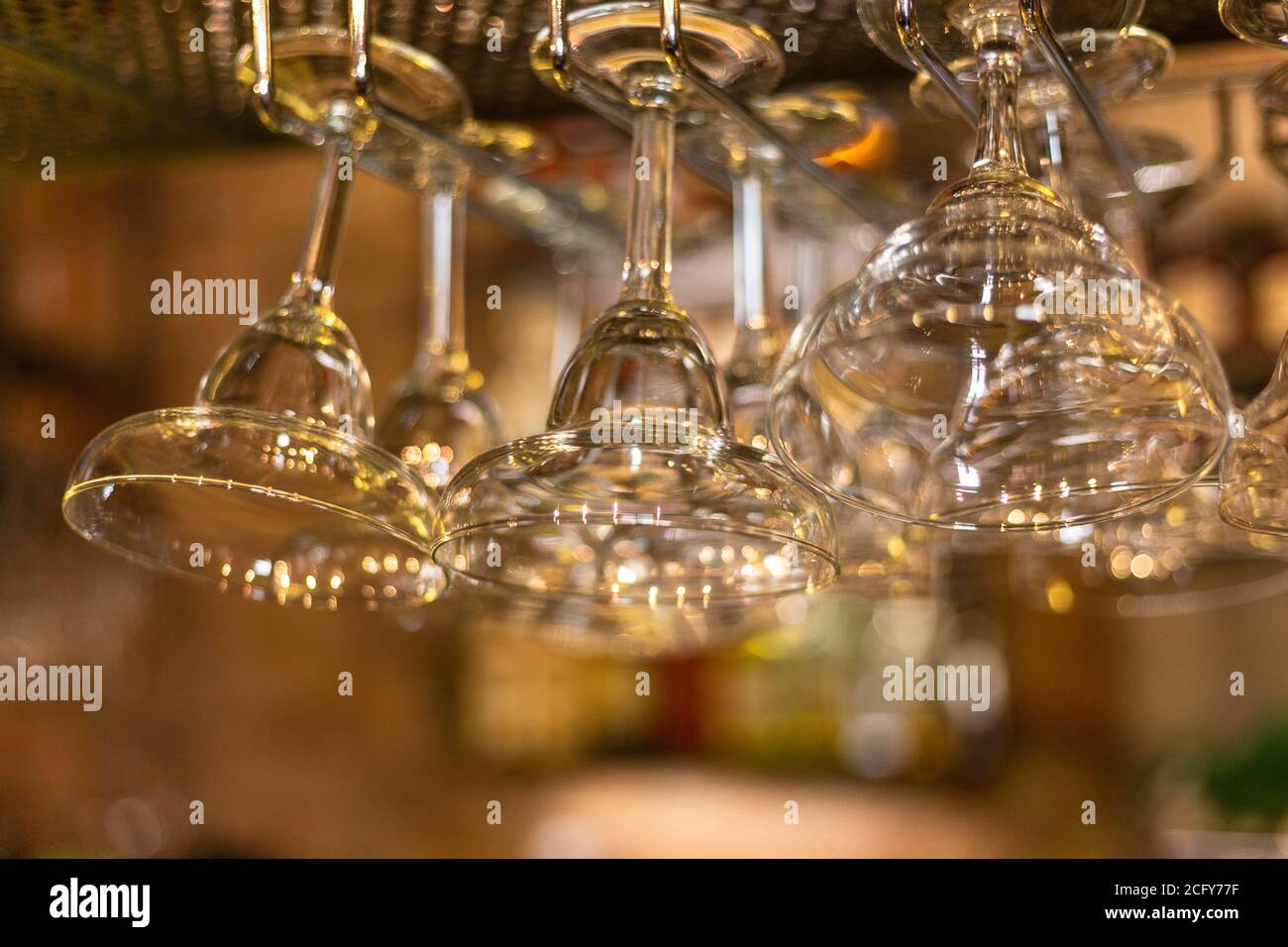 Glass goblets in a bar. Glare and light.  Stock Photo