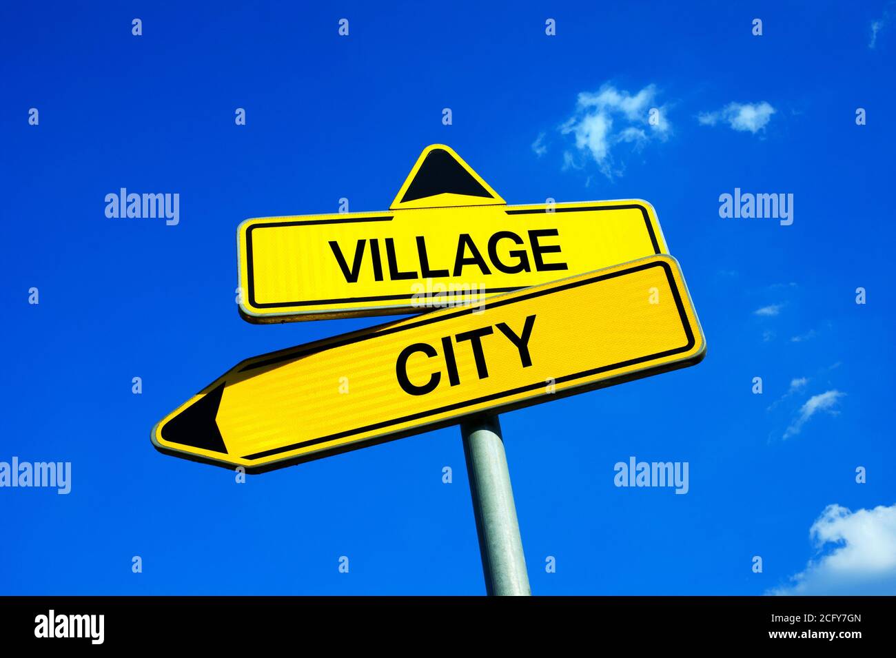 Village or City - Traffic sign with two options - advantage and disadvantage of settlement and living in big city or rural and rustic countryside. Que Stock Photo