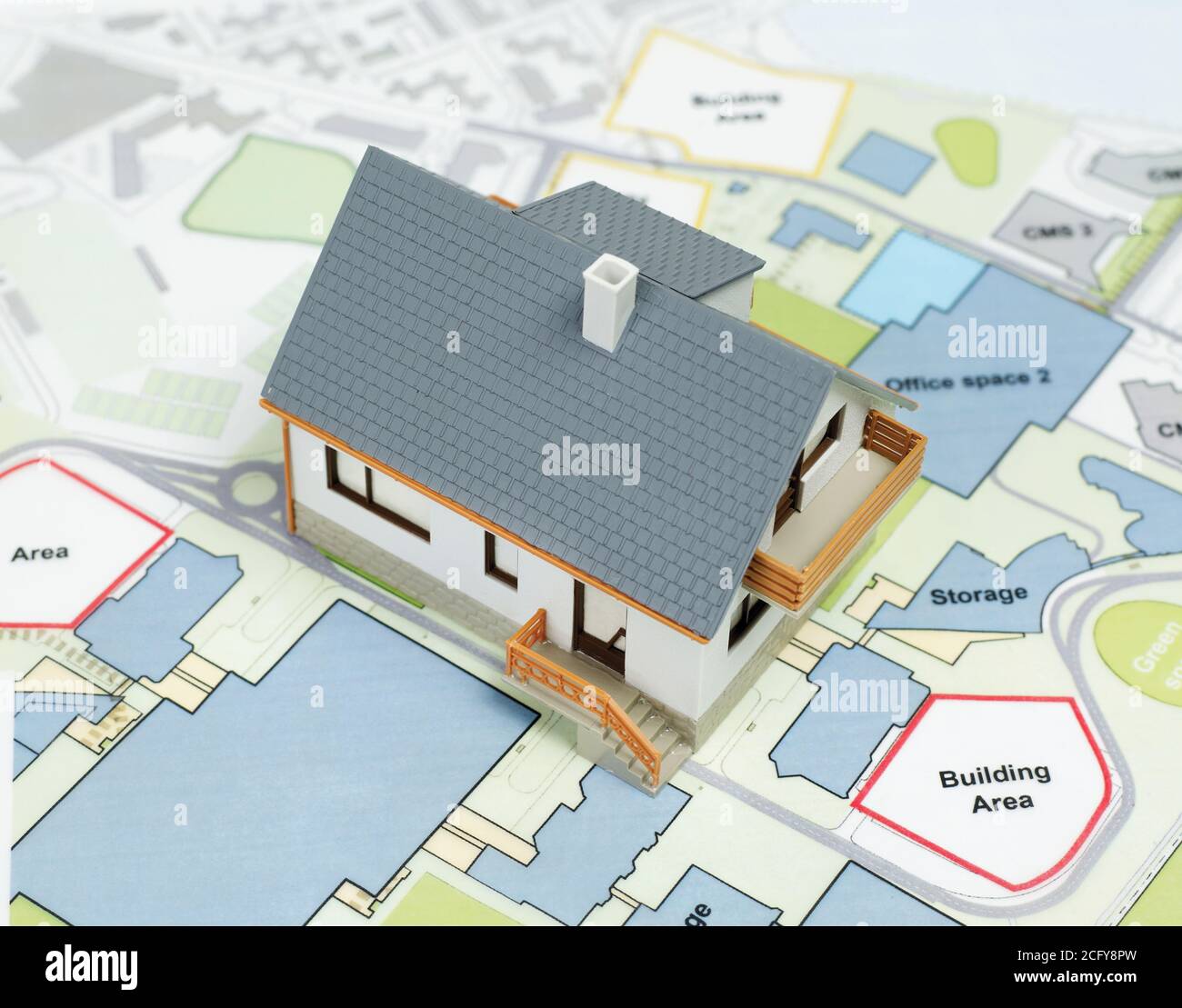 Model house on top of blueprints Stock Photo