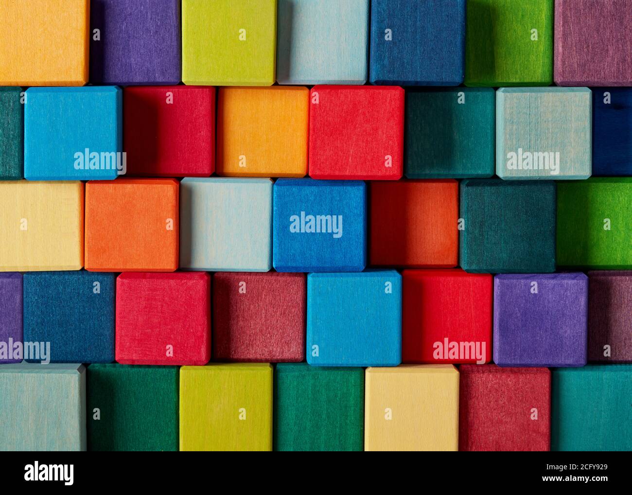 Multi-colored wooden toy blocks background Stock Photo