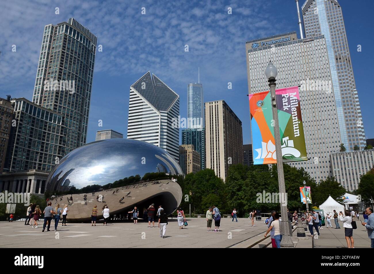Chicago Millennium Park reflection clouds and skyline at the Cloud Gate ...