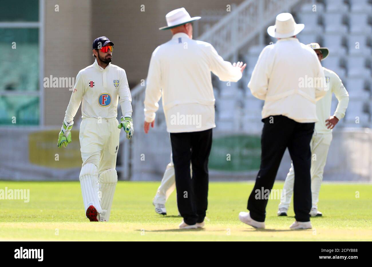 Match umpires call over Durham's Ned Eckersley (left) during day three of the Bob Willis Trophy match at Trent Bridge, Nottingham. Stock Photo