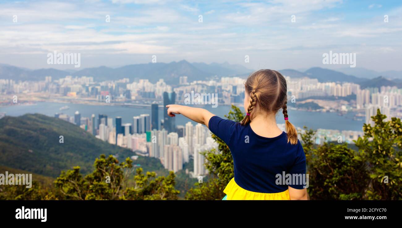 Family with kids hiking in Hong Kong mountains. Beautiful landscape