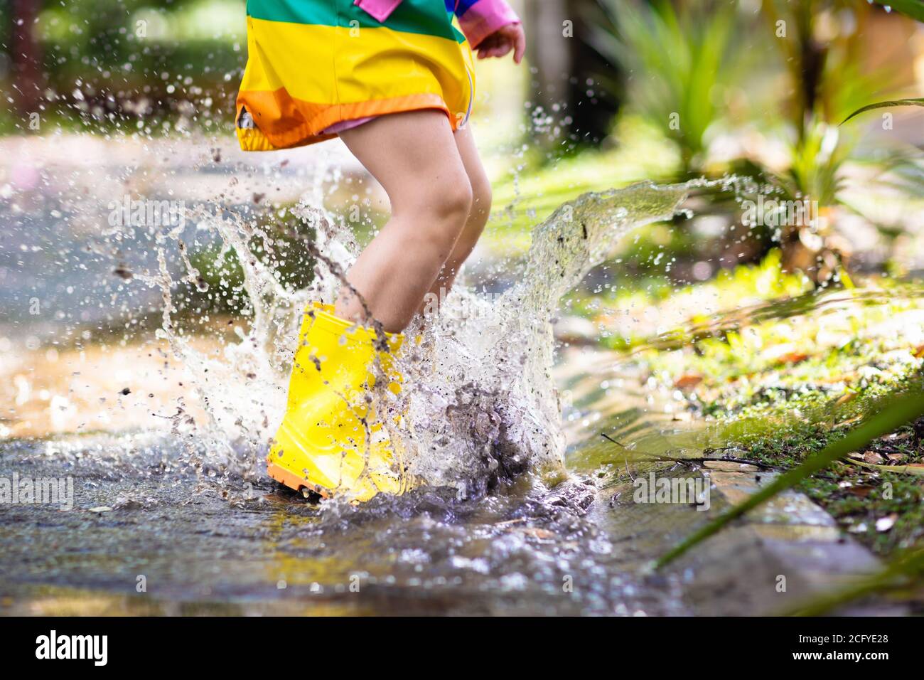 Little Girl Running Yellow Jacket
