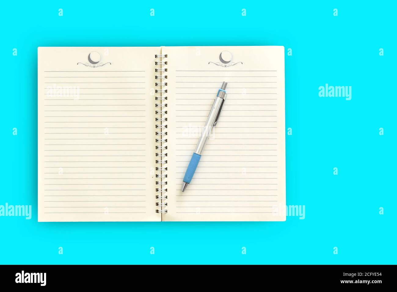 Notebook,pen on a blue background. top view copy space Stock Photo