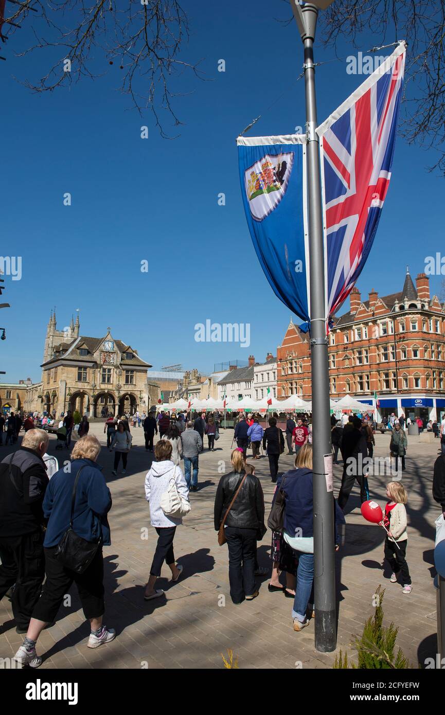 Peterborough Guildhall and an Italian Market  in Cathedral Square, Peterborough, Cambridgeshire, England. Stock Photo