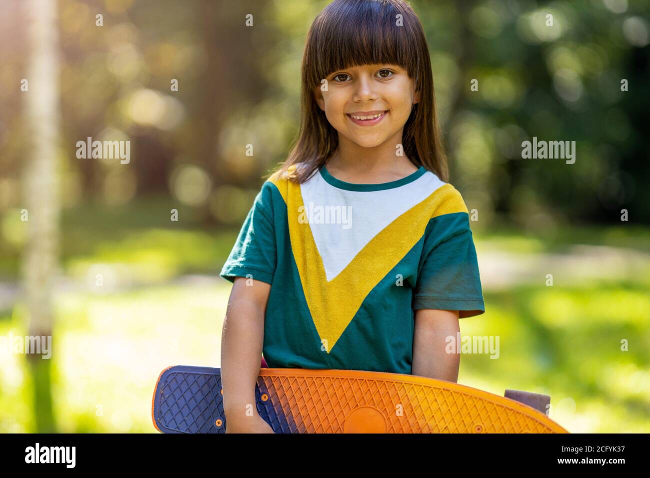 Portrait of cute little girl smiling outdoors Stock Photo - Alamy