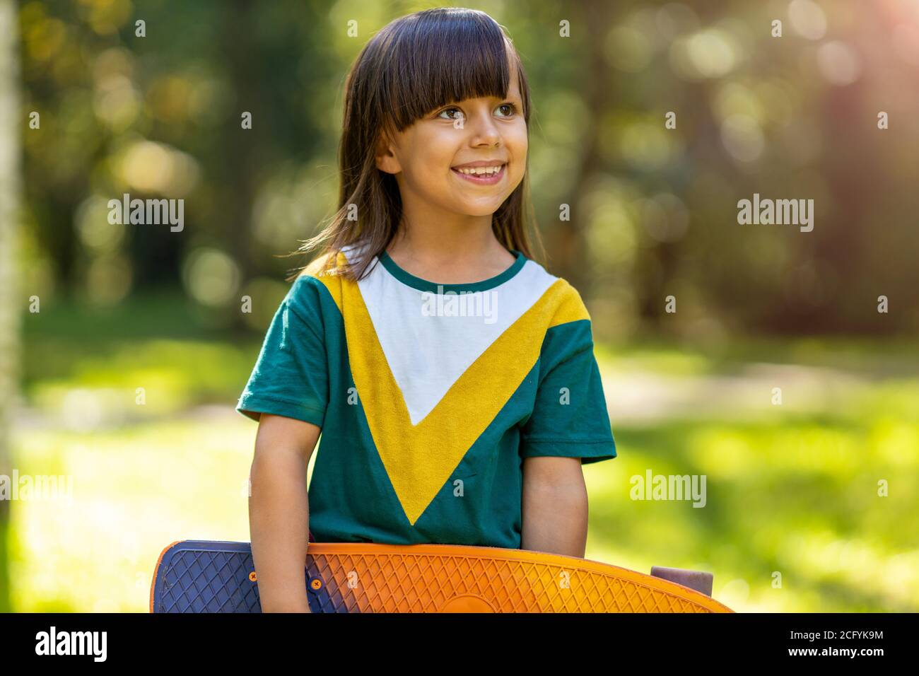Portrait of cute little girl smiling outdoors Stock Photo - Alamy