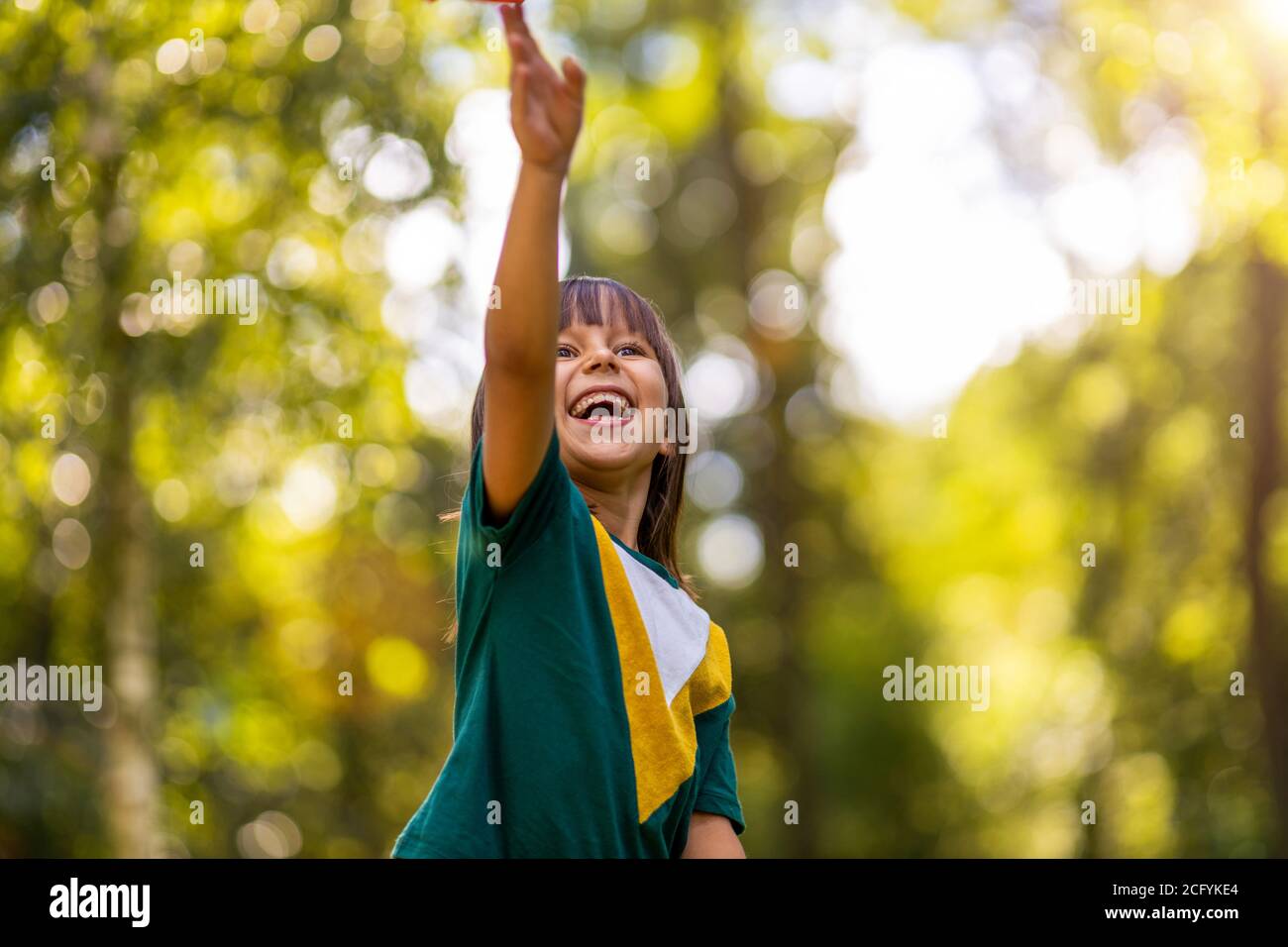 Portrait of cute little girl smiling outdoors Stock Photo - Alamy