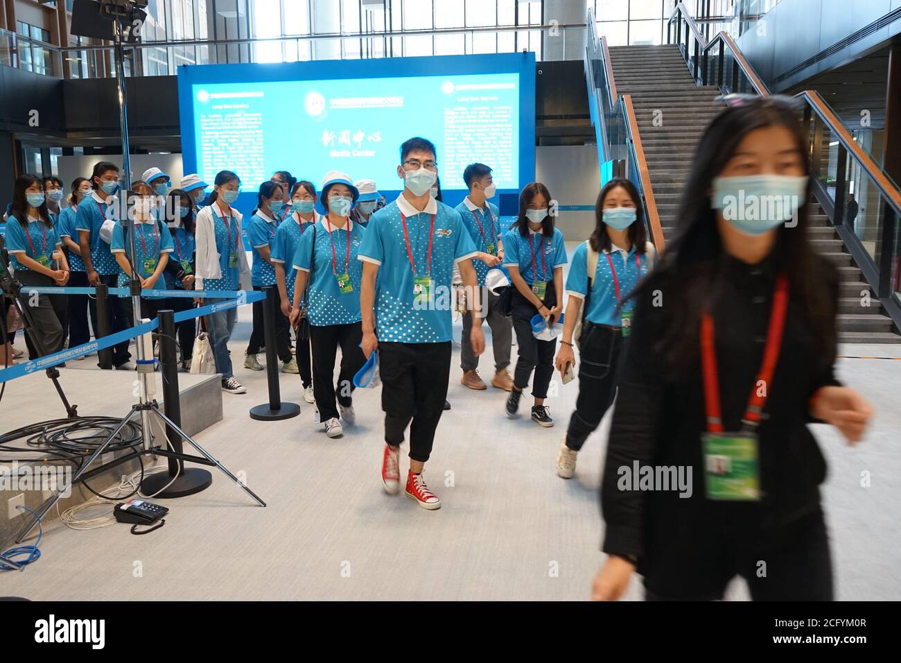 Beijing, China. 3rd Sep, 2020. Volunteers wearing masks visit the media center of the 2020 China International Fair for Trade in Services (CIFTIS) in Beijing, capital of China, Sept. 3, 2020. The 2020 CIFTIS is the first major international economic and trade event held both online and offline by China since the COVID-19 outbreak. Credit: Zheng Yue/Xinhua/Alamy Live News Stock Photo
