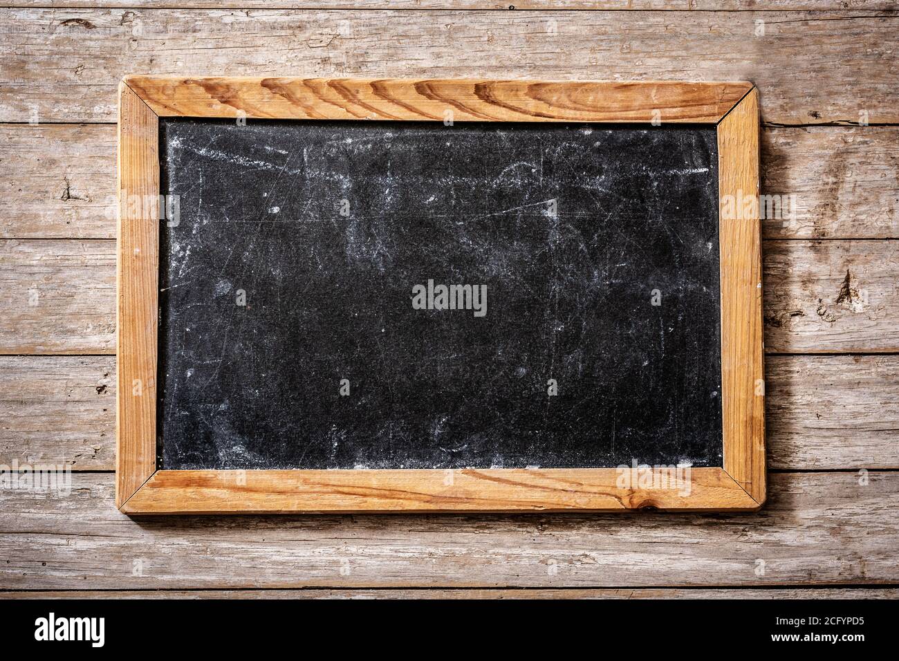Blackboard on wooden background Stock Photo