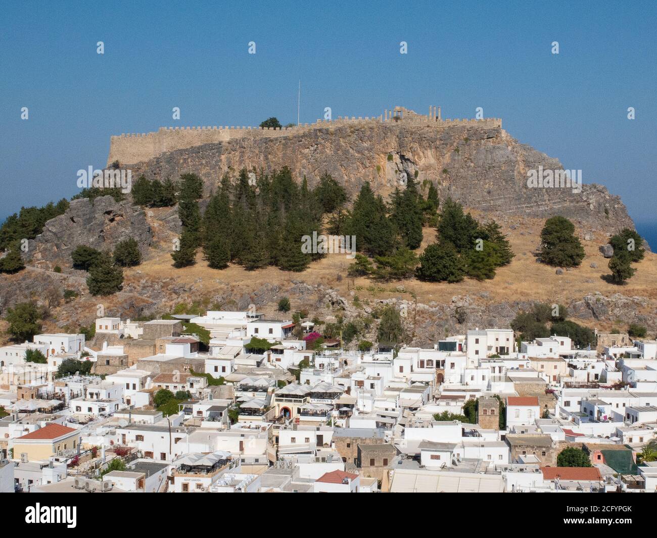 Lindos fishing village and Lindos Acropolis Rhodes Greece Stock Photo