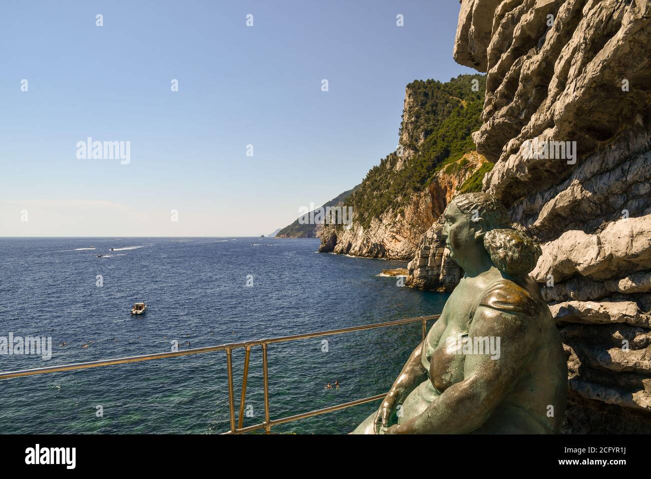 Bronze sculpture 'Mater Naturae' by the artist Lello Scorzelli, placed on the cliff overlooking the bay of Lord Byron, Porto Venere, La Spezia, Italy Stock Photo