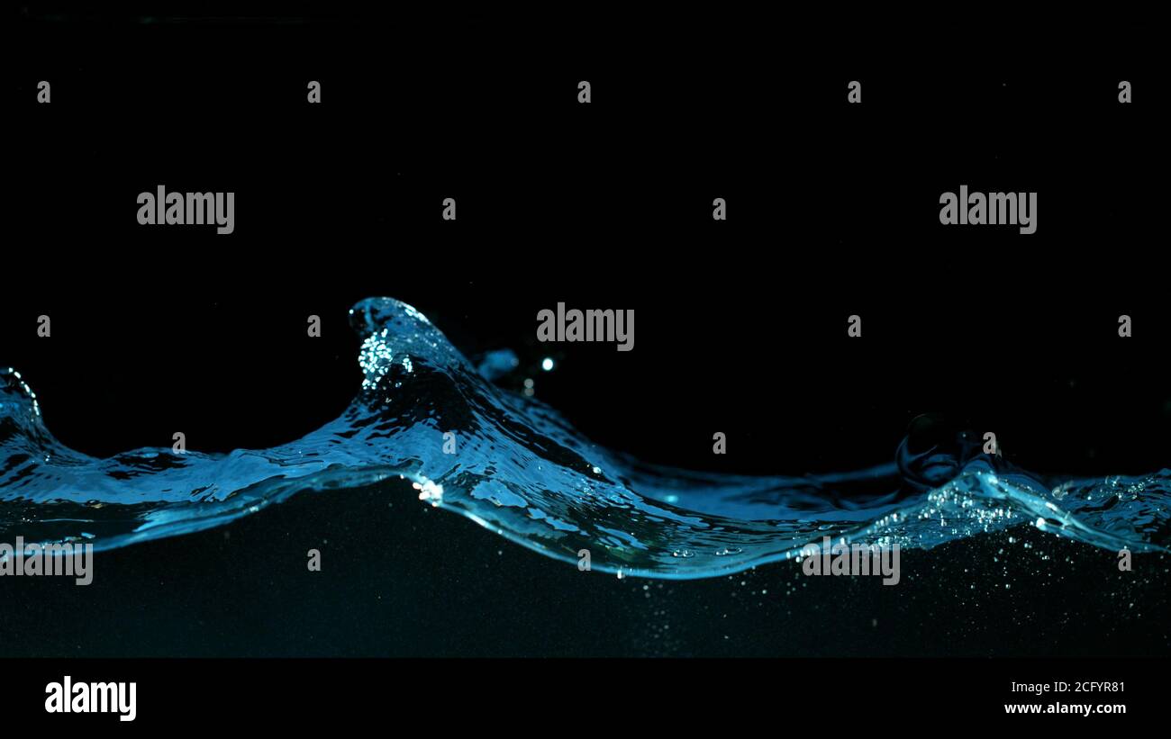 Abstract splashing water wave isolated on black background Stock Photo