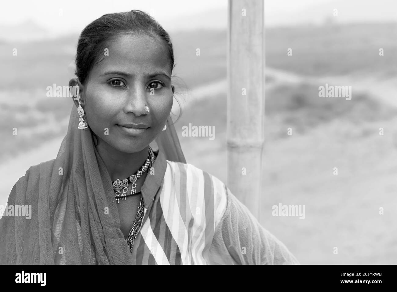 Portrait of nomadic gypsy woman in colorful ethnic clothes in Thar desert  near Pushkar, Rajasthan, India. Stock Photo