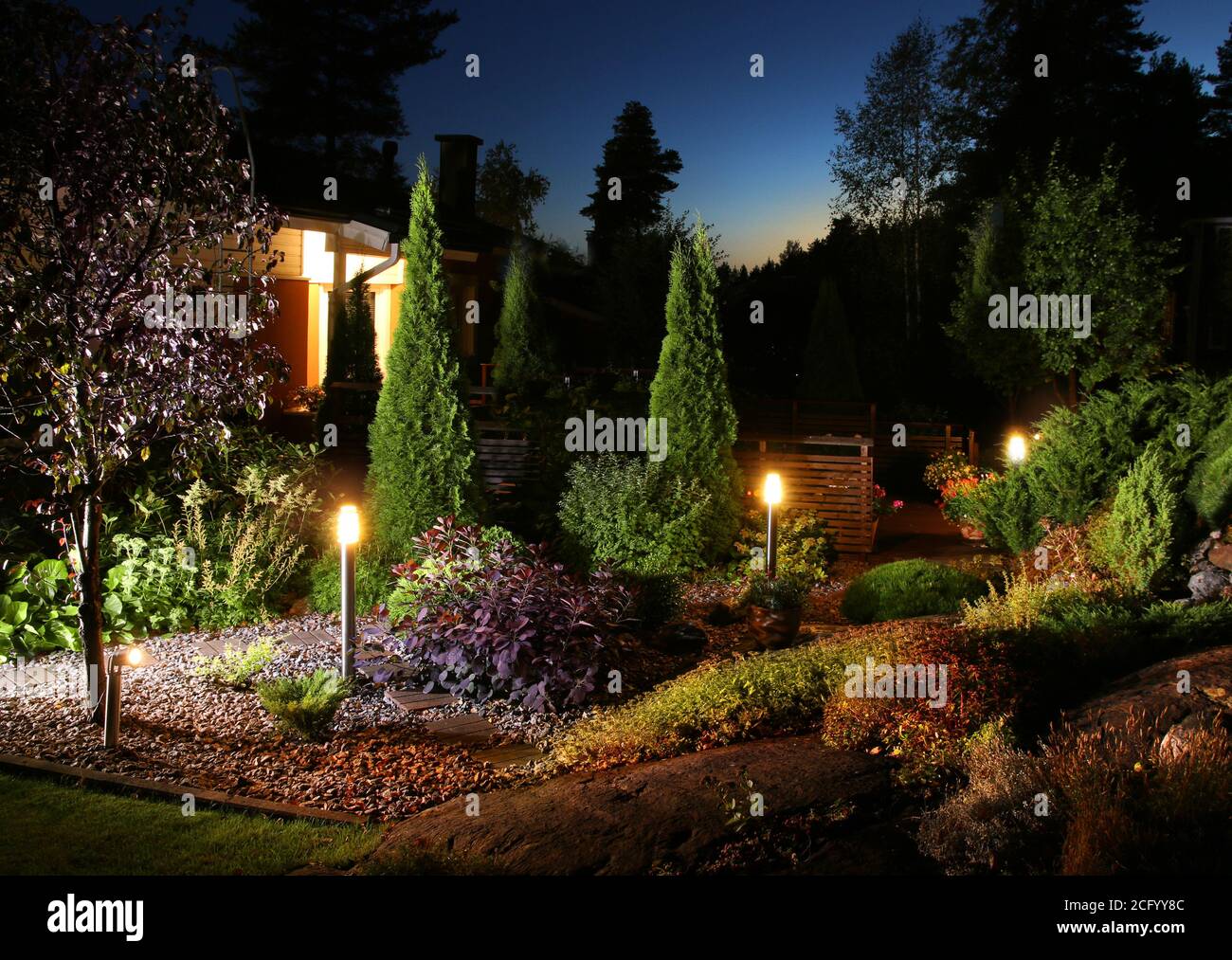 Home garden illumination autumn evening patio lights Stock Photo