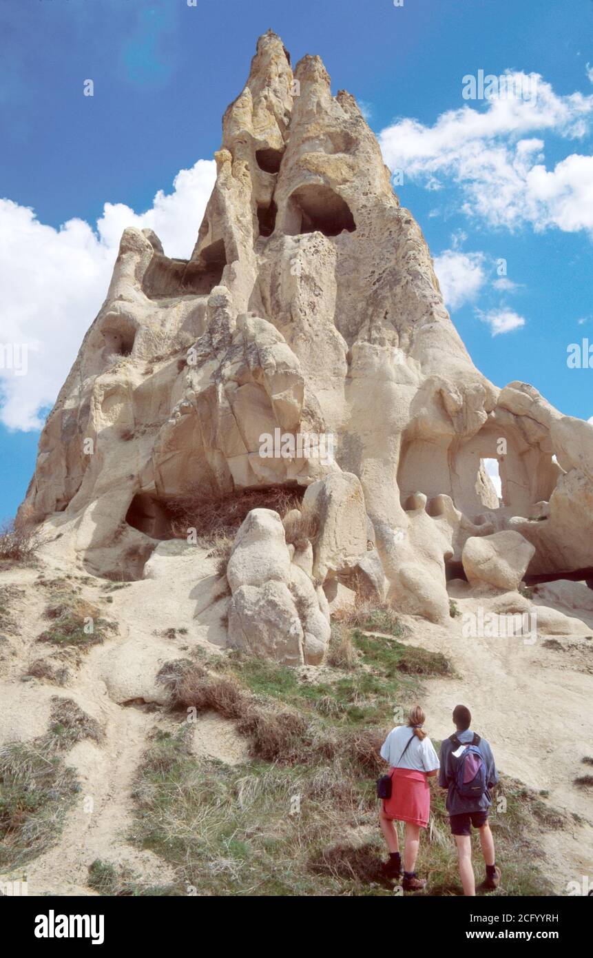 Turkey Turkish Cappadocia Goreme Valley National Park Museum,exhibit exhibition,hikers hiking man men male woman female women couple couples,Monastery Stock Photo