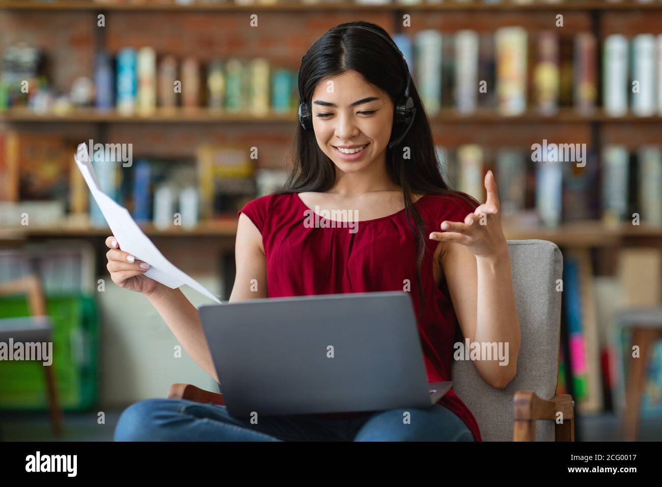 Remote Business. Smiling Asian Woman Talking With Business Partners Via Online Conference Stock Photo