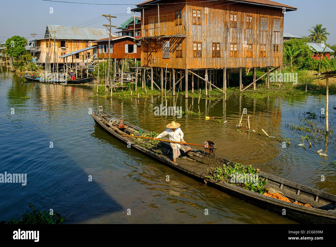 Myanmar (Burma), Shan state, Inle Lake, lakeside village of Inn Paw Khone, stilt houses, working on chanels Stock Photo