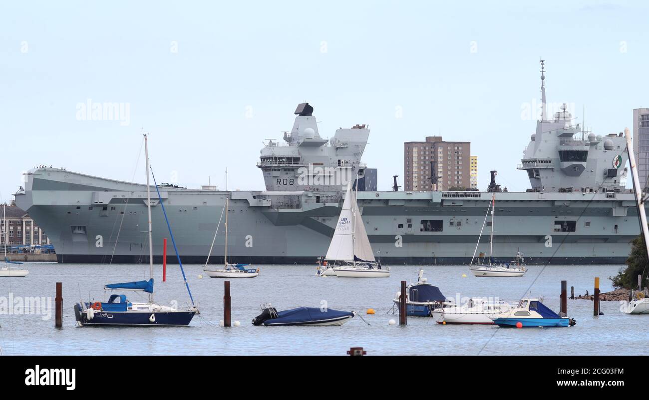 The Royal Navy aircraft carrier HMS Queen Elizabeth moored up at HMNB Portsmouth after its departure from the naval base for training exercises at sea was postponed for the second day in a row after a number of crew members tested positive for Covid-19. Stock Photo