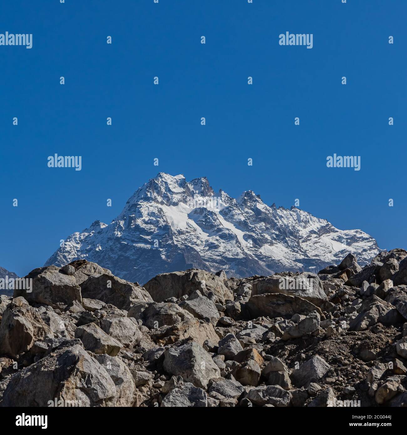 A postcard image of a majestic peak with blue sky on the horizon on the Tibetan plateau of Sikkim India Stock Photo