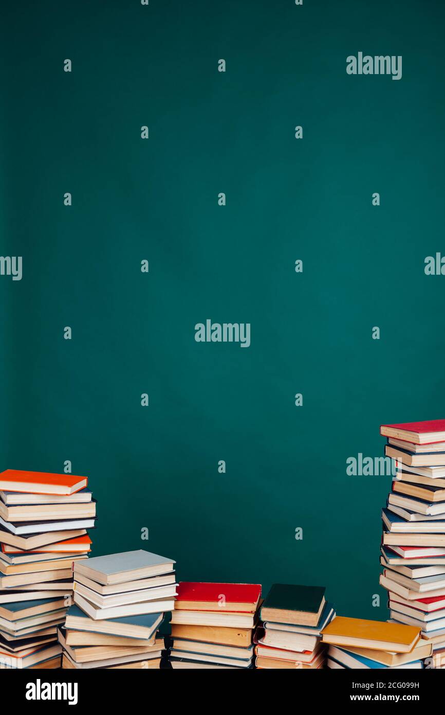many stacks of educational books to study in the university library as ...