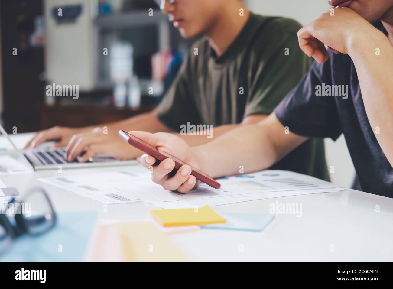 Programmer and UX UI designer working in a software development and coding technologies. Mobile and website design and programing development technolo Stock Photo