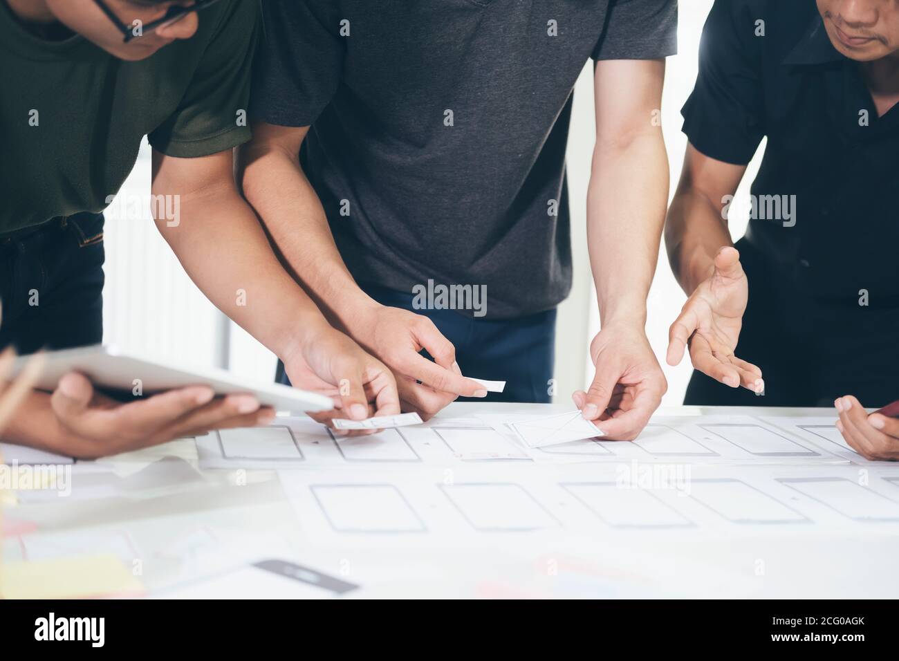 Programmer and UX UI designer working in a software development and coding technologies. Mobile and website design and programing development technolo Stock Photo