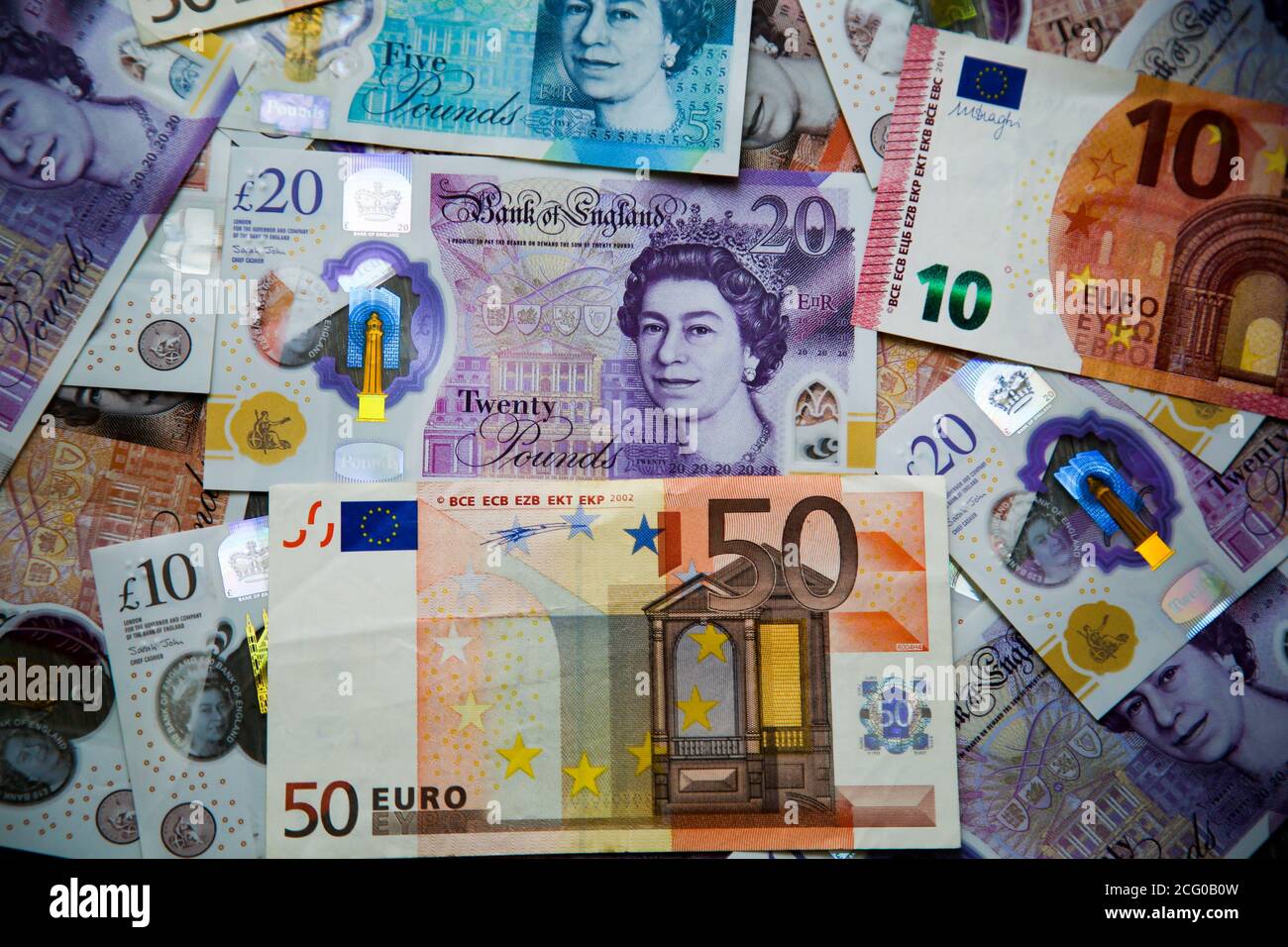 In this photo illustration, a collection of British five, ten and twenty  pound sterling and ten and fifty Euro banknotes are seen displayed Stock  Photo - Alamy