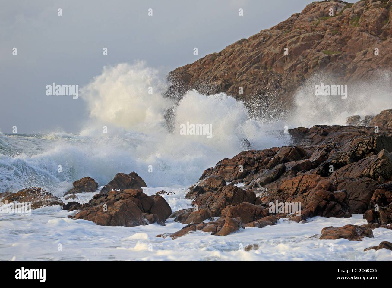 Large storm waves crashing onto rocks in Craimneach Bay Isle of Coll Inner Hebrides, Scotland Stock Photo