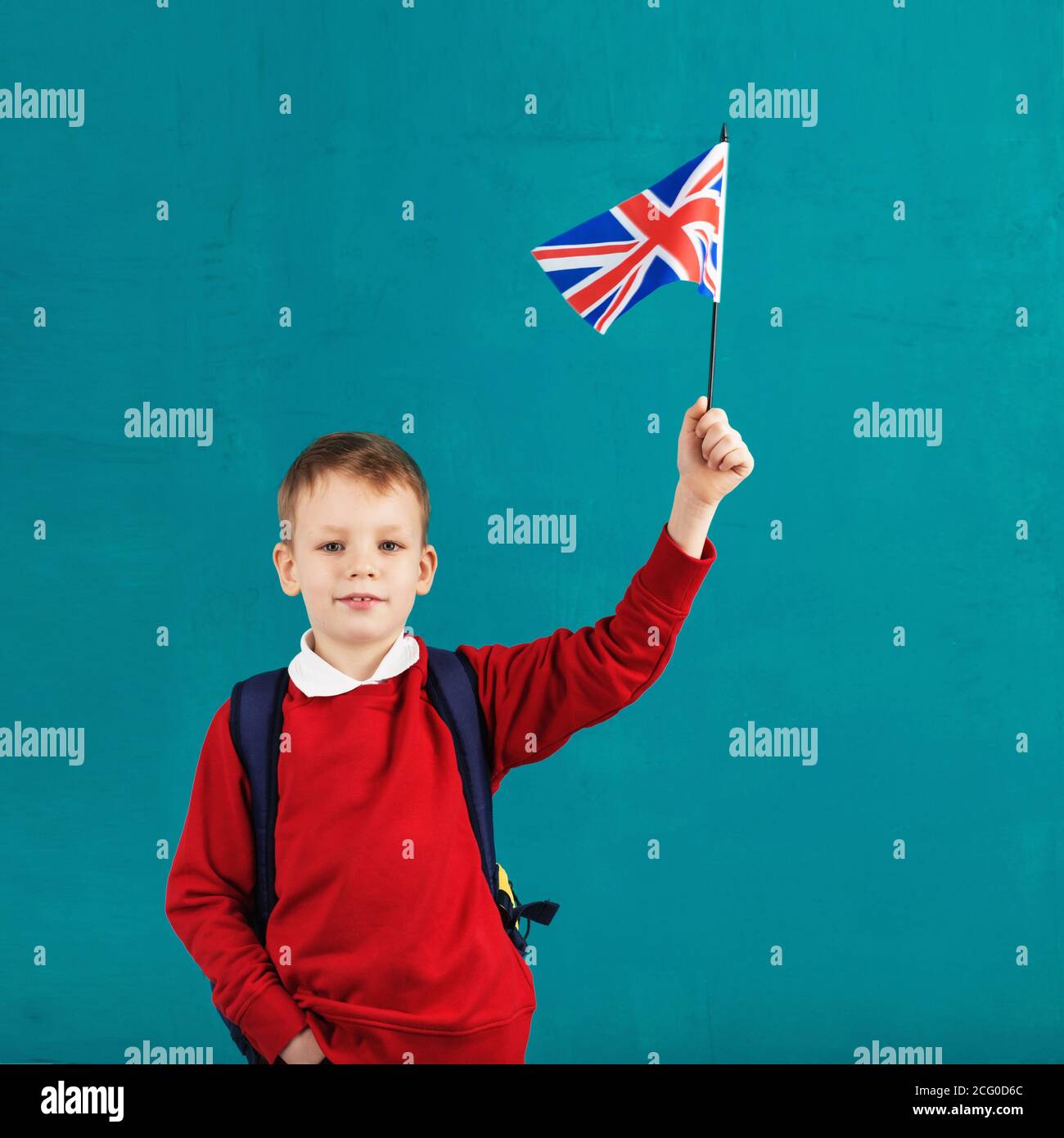 School Holidays United Kingdom (UK). Little schoolboy with national