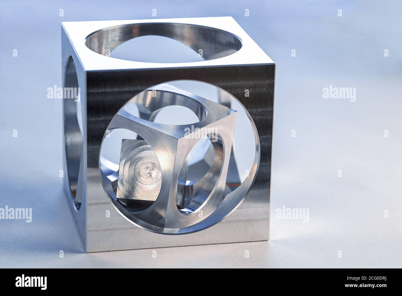 Cube in cube, workpiece on a CNC milling machine Stock Photo