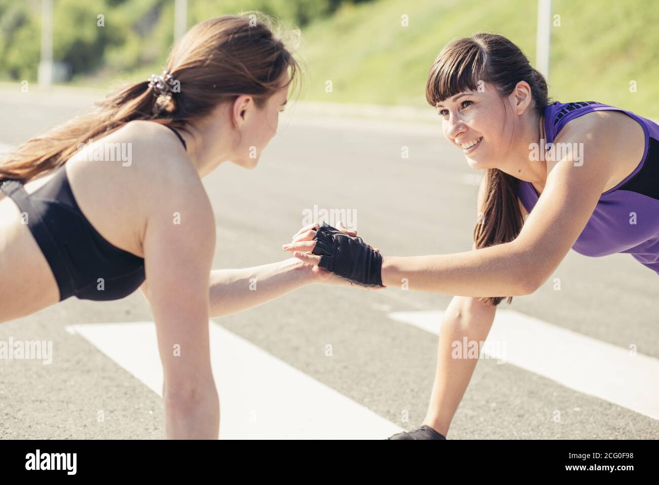Side view of a group of fitness people doing push ups Stock Photo - Alamy