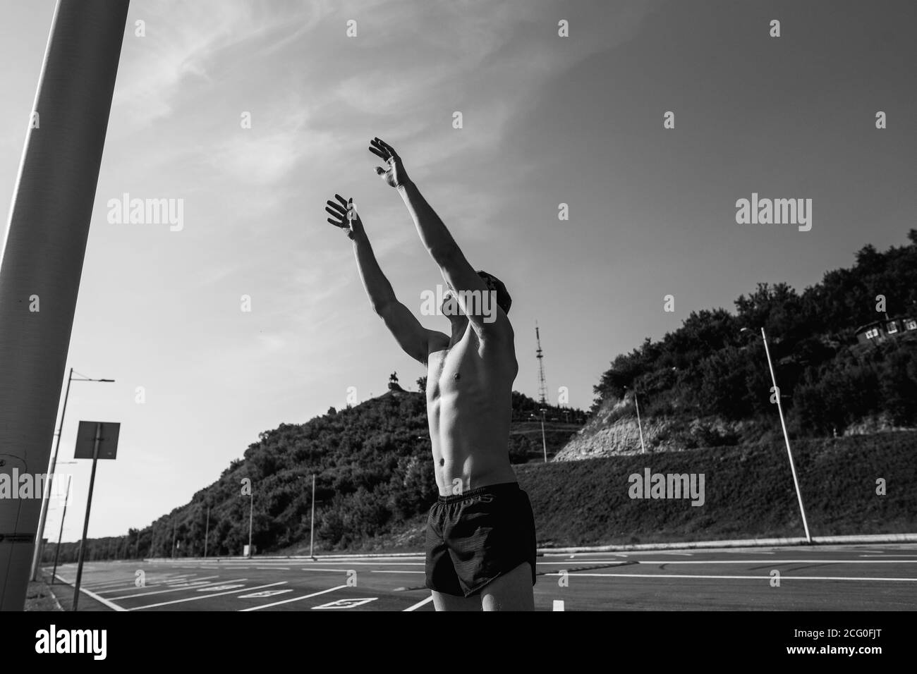 man exercising by throwing a medicine ball up Stock Photo