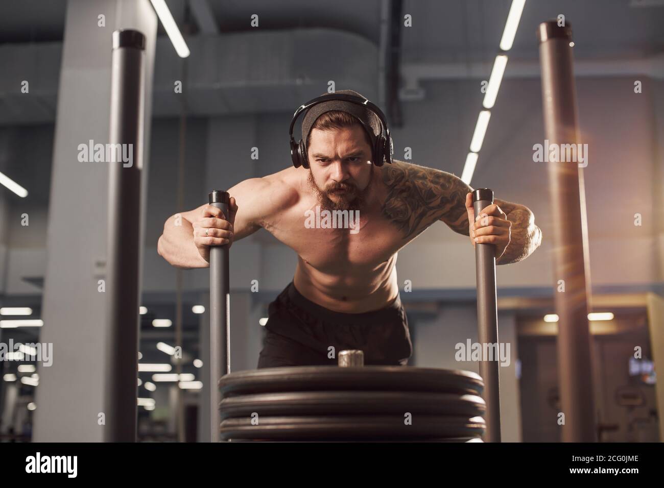 sled push man pushing weights workout exercise at gym Stock Photo Alamy
